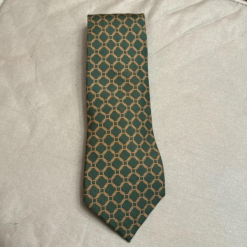 HERMES TIE 100% SILK in green background with light cream rope design.   GUC